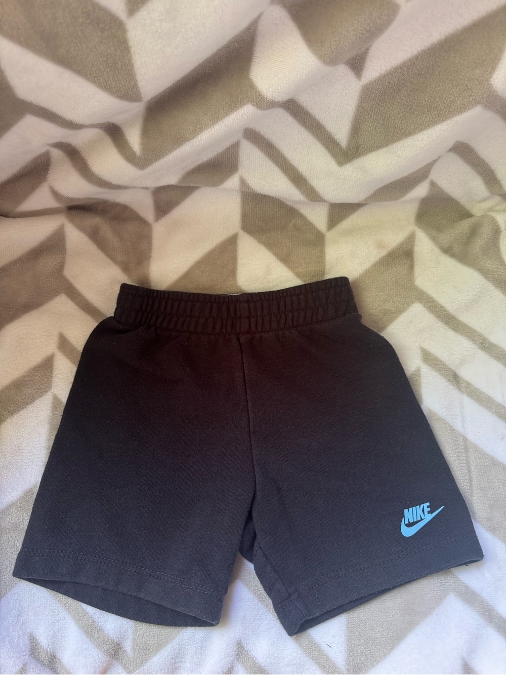 Nike Black Kids Shorts with Light Blue Swoosh